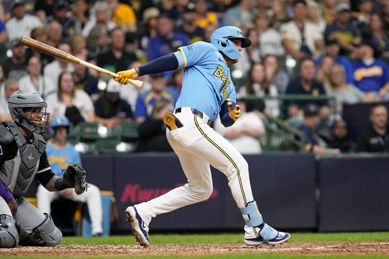 May 31, 2024; Milwaukee, Wisconsin, USA;  Milwaukee Brewers second baseman Brice Turang (2) hits an RBI single during the seventh inning against the Chicago White Sox at American Family Field. Mandatory Credit: Jeff Hanisch-USA TODAY Sports