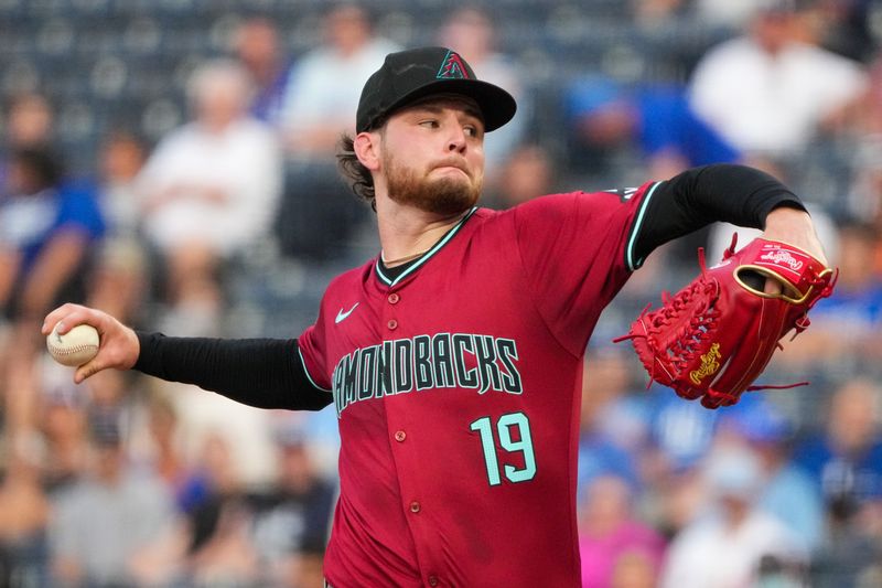 Jul 24, 2024; Kansas City, Missouri, USA; Arizona Diamondbacks starting pitcher Ryne Nelson (19) delivers a pitch against the Kansas City Royals in the first inning at Kauffman Stadium. Mandatory Credit: Denny Medley-USA TODAY Sports