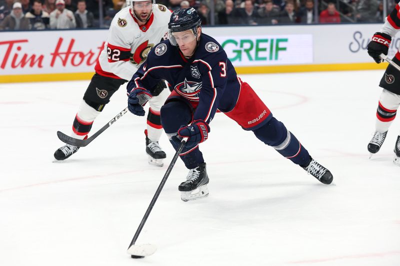 Dec 11, 2025; Columbus, Ohio, USA;  Columbus Blue Jackets center Charlie Coyle (3) chases the puck as Ottawa Senators right wing Michael Amadio (22) defends during the second period at Nationwide Arena. Mandatory Credit: Joseph Maiorana-Imagn Images