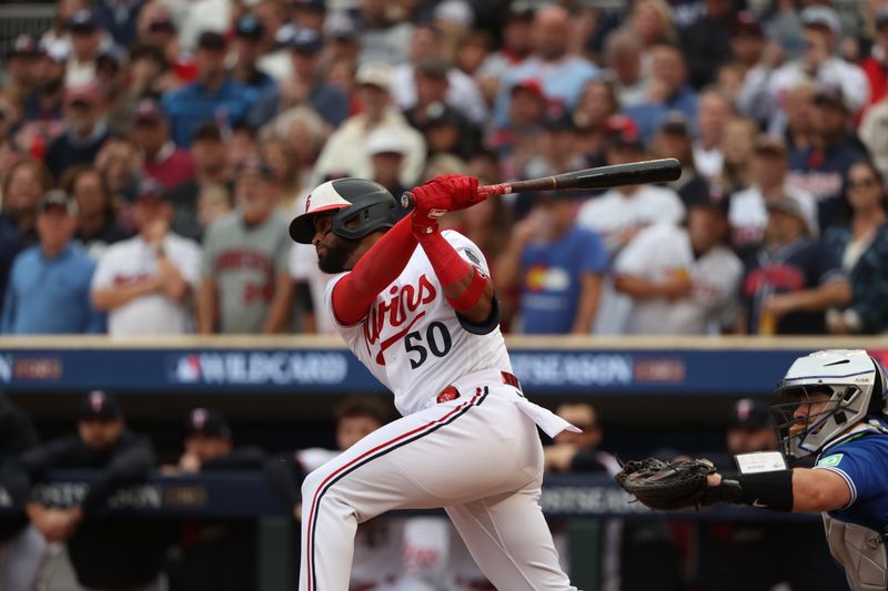Oct 4, 2023; Minneapolis, Minnesota, USA; Minnesota Twins left fielder Willi Castro (50) gets a hit in the fourth inning against the Toronto Blue Jays during game two of the Wildcard series for the 2023 MLB playoffs at Target Field. Mandatory Credit: Jesse Johnson-USA TODAY Sports