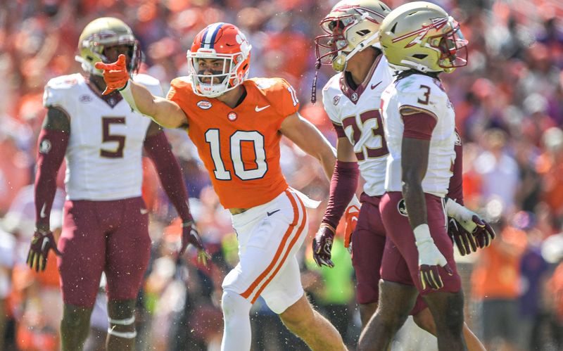 Sep 23, 2023; Clemson, South Carolina, USA; Clemson Tigers wide receiver Troy Stellato (10) reacts after catching a ball against Florida State Seminoles defensive back Kevin Knowles II (3) for a first down during the third quarter  at Memorial Stadium. Mandatory Credit: Ken Ruinard-USA TODAY Sports