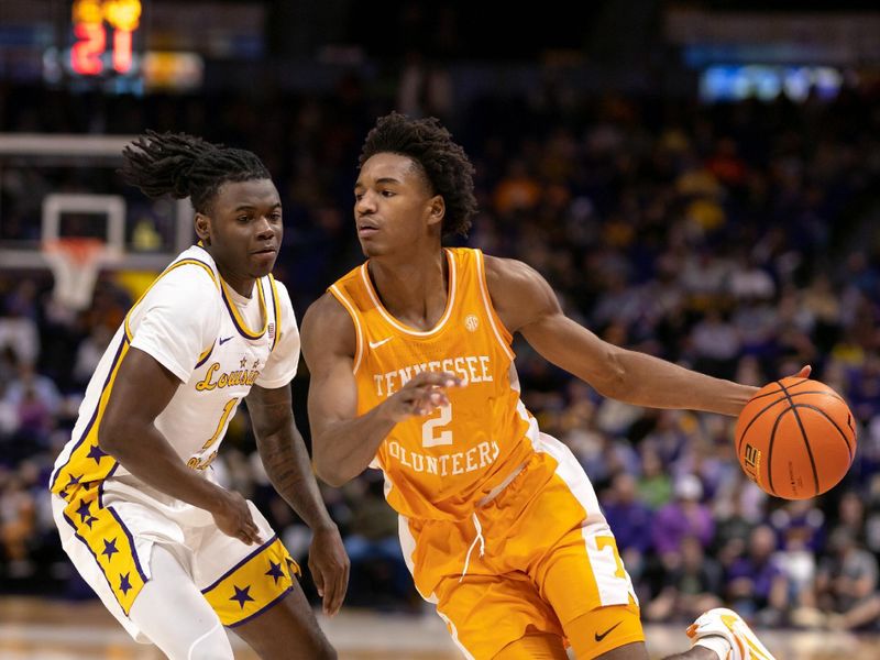 Jan 21, 2023; Baton Rouge, Louisiana, USA;  Tennessee Volunteers forward Julian Phillips (2) dribbles the ball against LSU Tigers guard Cam Hayes (1) during the second half at Pete Maravich Assembly Center. Mandatory Credit: Stephen Lew-USA TODAY Sports