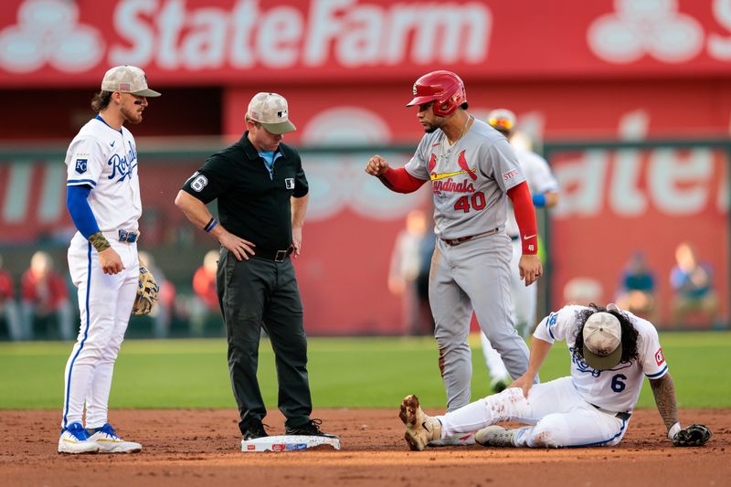 May 17, 2025; Kansas City, Missouri, USA; Kansas City Royals shortstop Bobby Witt Jr. (7) looks on after St. Louis Cardinals first base Willson Contreras (40) hits Kansas City Royals third base Jonathan India (6) in the knee sliding into second base during the second inning at Kauffman Stadium. Mandatory Credit: William Purnell-Imagn Images