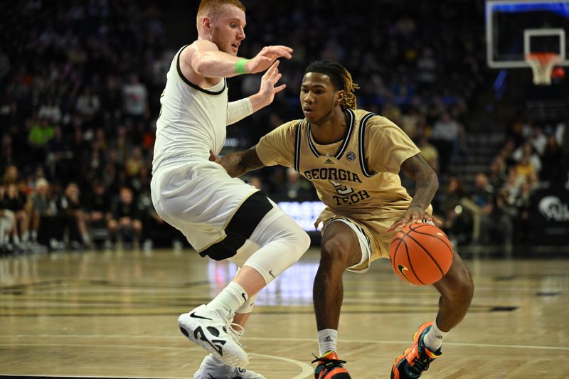 Feb 11, 2023; Winston-Salem, North Carolina, USA; Georgia Tech Yellow Jackets guard Deivon Smith (5) drives against Wake Forest Demon Deacons guard Cameron Hildreth (left) during the second half at Lawrence Joel Veterans Memorial Coliseum. Mandatory Credit: William Howard-USA TODAY Sports