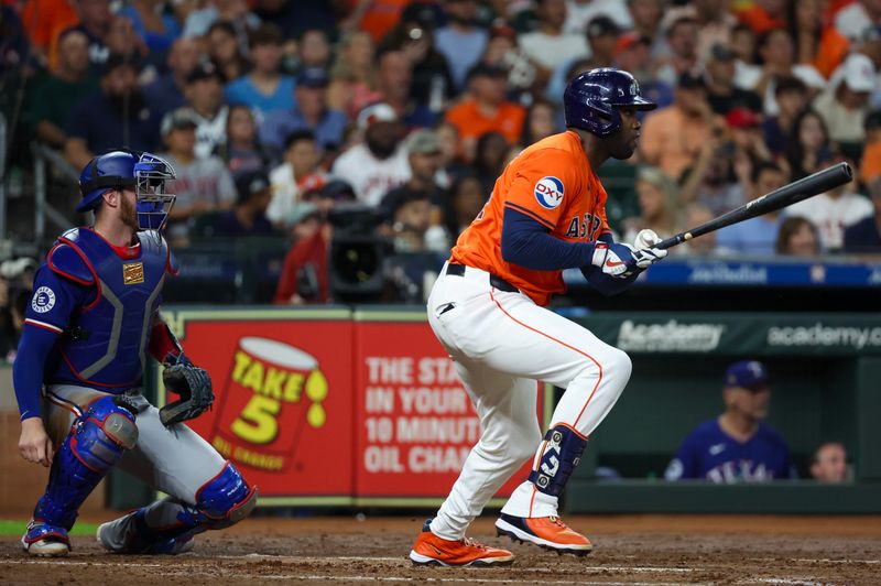 Jul 12, 2024; Houston, Texas, USA;  Houston Astros designated hitter Yordan Alvarez (44) hits a RBI single against the Texas Rangers in the third  inning at Minute Maid Park. Mandatory Credit: Thomas Shea-USA TODAY Sports