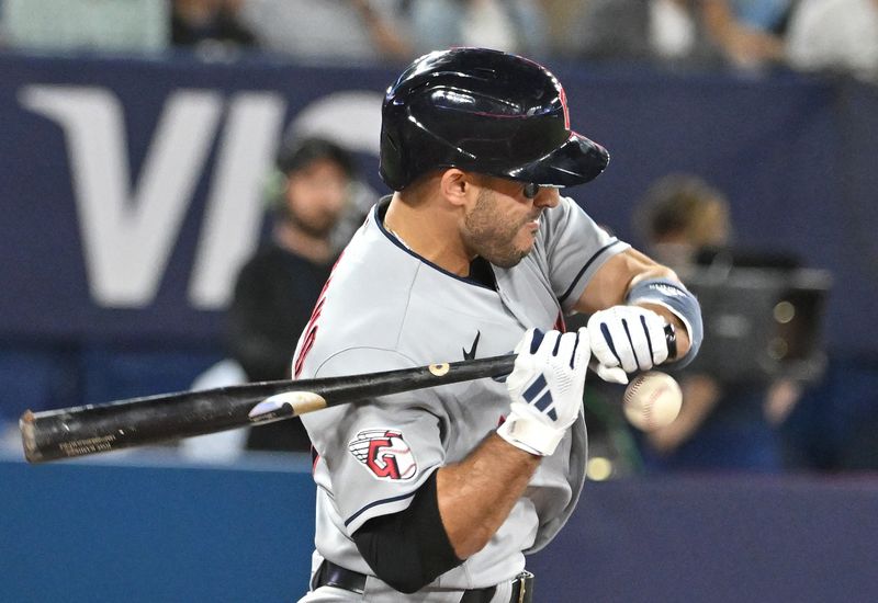 Aug 26, 2023; Toronto, Ontario, CAN;  Cleveland Guardians right fielder Ramon Laureano (10) is hit by a pitch against the Toronto Blue Jays in the sixth inning at Rogers Centre. Mandatory Credit: Dan Hamilton-USA TODAY Sports