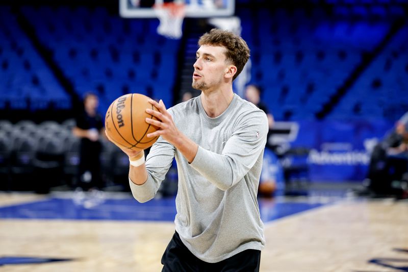 ORLANDO, FL - MARCH 30: Franz Wagner #22 of the Orlando Magic warms up prior to the start of the game against the Memphis Grizzlies at the Kia Center on March 30, 2024 in Orlando, Florida. NOTE TO USER: User expressly acknowledges and agrees that, by downloading and or using this photograph, User is consenting to the terms and conditions of the Getty Images License Agreement. (Photo by Don Juan Moore/Getty Images)