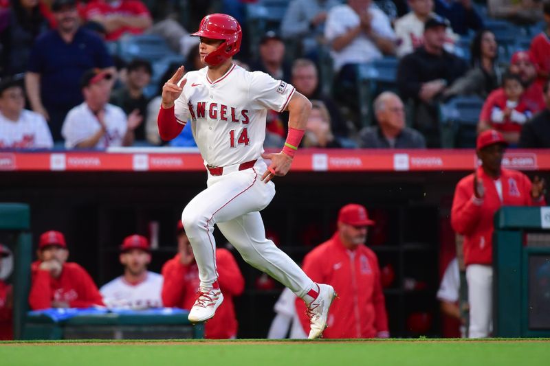 Apr 23, 2024; Anaheim, California, USA; Los Angeles Angels catcher Logan O'Hoppe (14) runs home to score against the Baltimore Orioles during the third inning at Angel Stadium. Mandatory Credit: Gary A. Vasquez-USA TODAY Sports