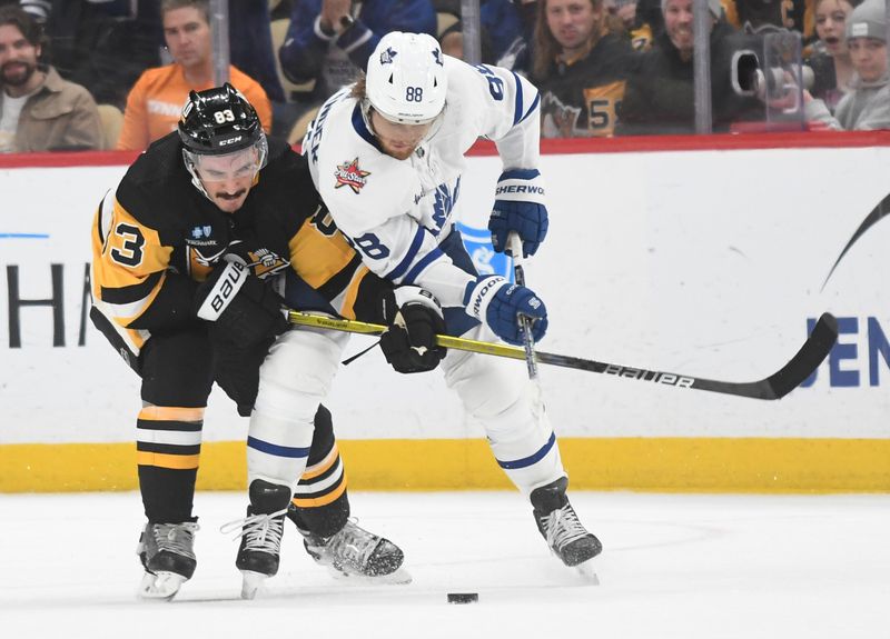 Nov 25, 2023; Pittsburgh, Pennsylvania, USA; Pittsburgh Penguins left wing Matt Nieto (83) and Toronto Maple Leafs  right wing William Nylander (88) battle for the puck during the third period at PPG Paints Arena. Mandatory Credit: Philip G. Pavely-USA TODAY Sports