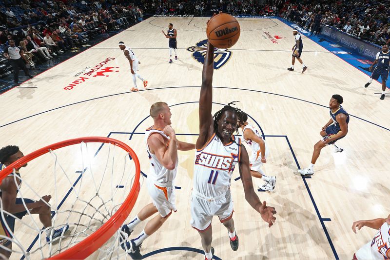 NEW ORLEANS, LA - DECEMBER 5: Bol Bol #11 of the Phoenix Suns grabs the rebound during the game against the New Orleans Pelicans on December 5, 2024 at the Smoothie King Center in New Orleans, Louisiana. NOTE TO USER: User expressly acknowledges and agrees that, by downloading and or using this Photograph, user is consenting to the terms and conditions of the Getty Images License Agreement. Mandatory Copyright Notice: Copyright 2024 NBAE (Photo by Layne Murdoch Jr./NBAE via Getty Images)