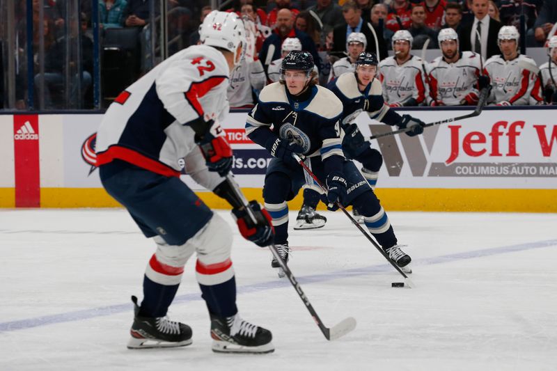 Dec 21, 2023; Columbus, Ohio, USA; Columbus Blue Jackets left wing Kent Johnson (91) skates with the puck against the Washington Capitals during the first period at Nationwide Arena. Mandatory Credit: Russell LaBounty-USA TODAY Sports