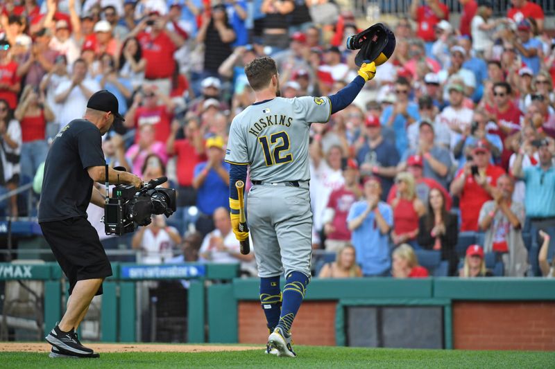 Jun 3, 2024; Philadelphia, Pennsylvania, USA; Milwaukee Brewers first base Rhys Hoskins (12) acknowledges the crowd on his return to Philadelphia before his at bat during the second inning against the Philadelphia Phillies at Citizens Bank Park. Mandatory Credit: Eric Hartline-USA TODAY Sports