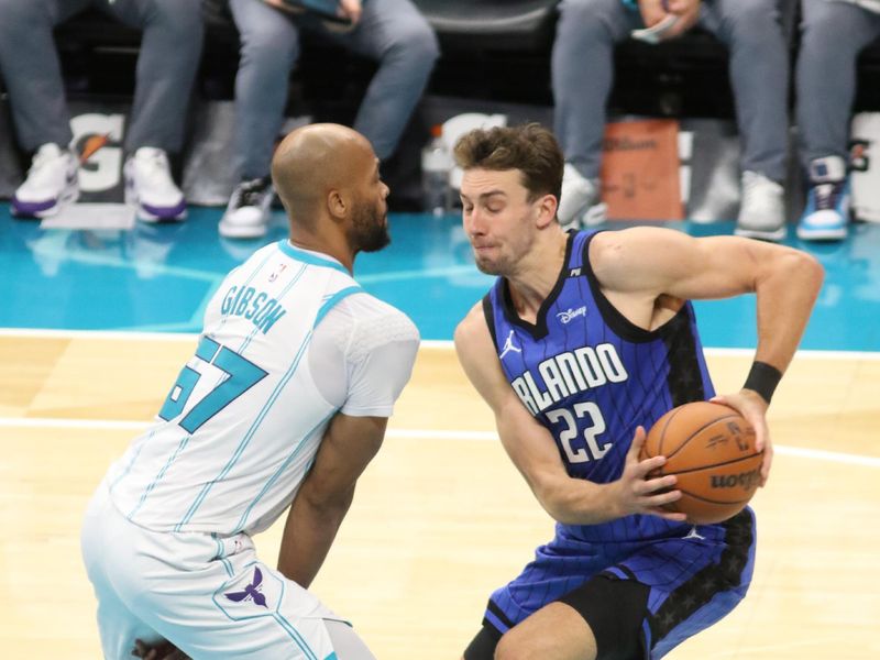 CHARLOTTE, NC -NOVEMBER 25:  Franz Wagner #22 of the Orlando Magic handles the ball during the game against the Charlotte Hornets on November 25, 2024 at Spectrum Center in Charlotte, North Carolina. NOTE TO USER: User expressly acknowledges and agrees that, by downloading and or using this photograph, User is consenting to the terms and conditions of the Getty Images License Agreement. Mandatory Copyright Notice: Copyright 2024 NBAE (Photo by Brock Williams-Smith/NBAE via Getty Images)