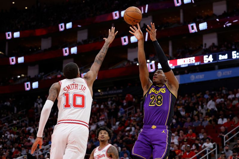 HOUSTON, TEXAS - NOVEMBER 08: Rui Hachimura #28 of the Los Angeles Lakersnshoots over Jabari Smith Jr. #10 of the Houston Rockets during the first half at Toyota Center on November 08, 2023 in Houston, Texas. NOTE TO USER: User expressly acknowledges and agrees that, by downloading and or using this photograph, User is consenting to the terms and conditions of the Getty Images License Agreement.? (Photo by Carmen Mandato/Getty Images)