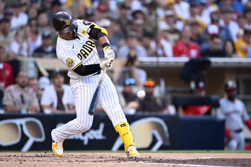 Jun 24, 2024; San Diego, California, USA; San Diego Padres designated hitter Donovan Solano (39) hits a single against the Washington Nationals during the second inning at Petco Park. Mandatory Credit: Orlando Ramirez-USA TODAY Sports