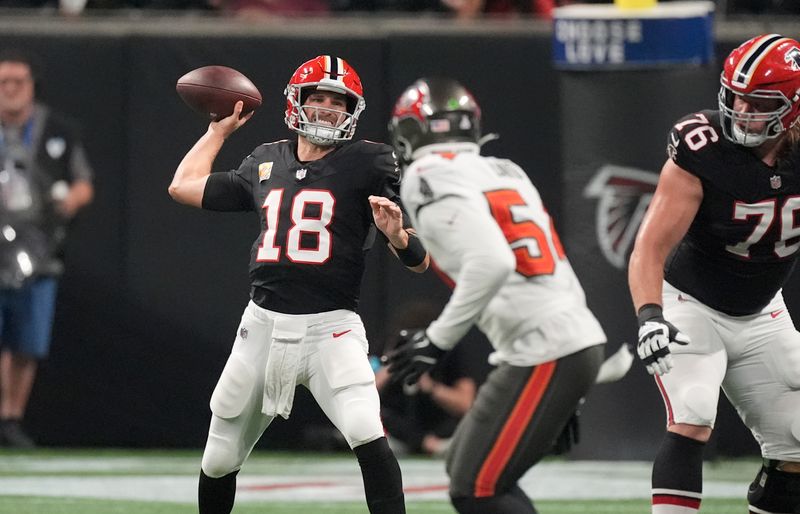 Atlanta Falcons quarterback Kirk Cousins (18) throws a pass against the Tampa Bay Buccaneers during the first half of an NFL football game Thursday, Oct. 3, 2024, in Atlanta. (AP Photo/John Bazemore)