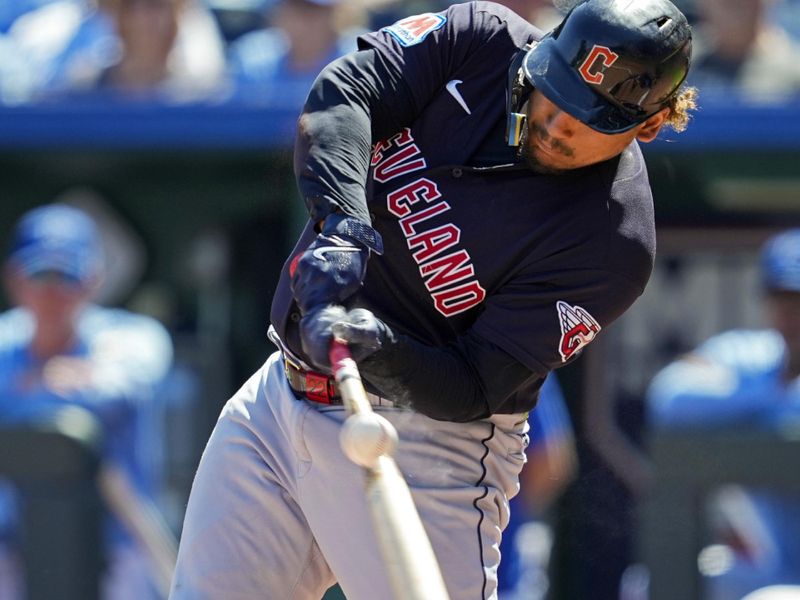 Sep 20, 2023; Kansas City, Missouri, USA; Cleveland Guardians designated hitter Josh Naylor (22) hits a single during the first inning against the Kansas City Royals at Kauffman Stadium. Mandatory Credit: Jay Biggerstaff-USA TODAY Sports