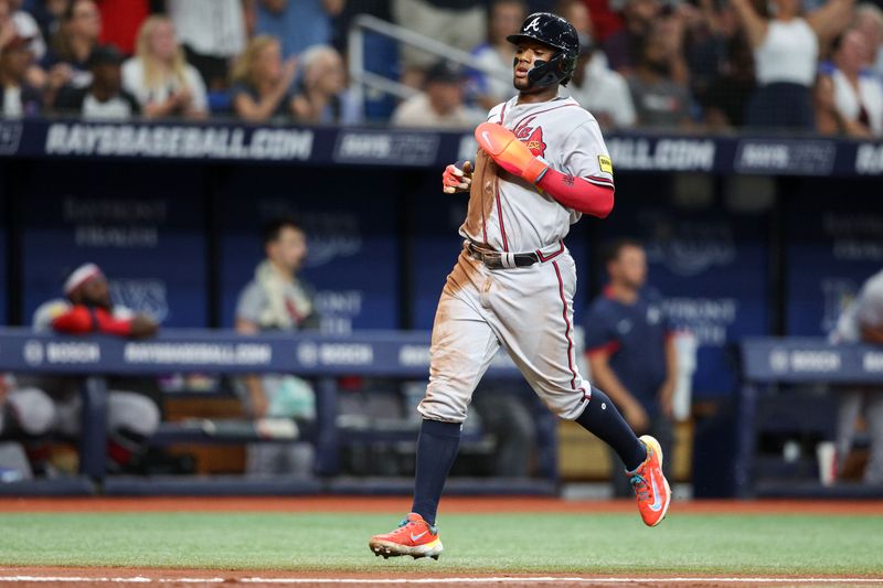 Jul 8, 2023; St. Petersburg, Florida, USA;  Atlanta Braves right fielder Ronald Acuna Jr. (13) scores a run against the Tampa Bay Rays in the fourth inning at Tropicana Field. Mandatory Credit: Nathan Ray Seebeck-USA TODAY Sports