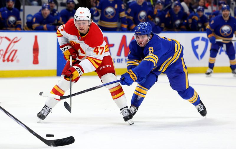 Nov 9, 2024; Buffalo, New York, USA;  Calgary Flames center Connor Zary (47) and Buffalo Sabres left wing Zach Benson (9) go after a loose puck during the third period at KeyBank Center. Mandatory Credit: Timothy T. Ludwig-Imagn Images