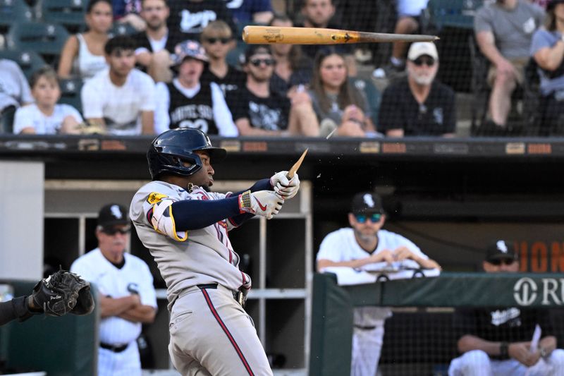 Jun 27, 2024; Chicago, Illinois, USA; Atlanta Braves second baseman Ozzie Albies (1) breaks his bat and pops up to Chicago White Sox catcher Martin Maldonado (not pictured) during the eighth inning at Guaranteed Rate Field. Mandatory Credit: Matt Marton-USA TODAY Sports