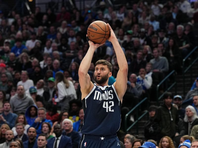 DALLAS, TX - JANUARY 27: Maxi Kleber #42 of the Dallas Mavericks shoots a three point basket during the game  on January 27, 2024 at the American Airlines Center in Dallas, Texas. NOTE TO USER: User expressly acknowledges and agrees that, by downloading and or using this photograph, User is consenting to the terms and conditions of the Getty Images License Agreement. Mandatory Copyright Notice: Copyright 2024 NBAE (Photo by Glenn James/NBAE via Getty Images)