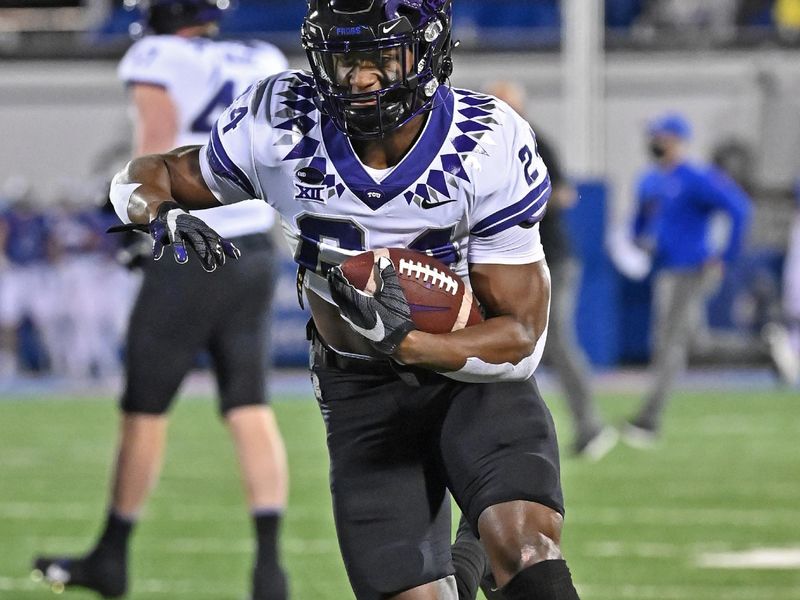 Nov 28, 2020; Lawrence, Kansas, USA; TCU Horned Frogs running back Darwin Barlow (24) runs up field during pre-game workouts, prior to a game against the Kansas Jayhawks at David Booth Kansas Memorial Stadium. Mandatory Credit: Peter Aiken-USA TODAY Sports