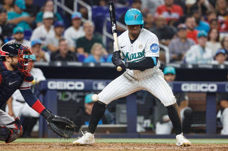 Sep 15, 2023; Miami, Florida, USA; Miami Marlins shortstop Xavier Edwards (63) is hit by a pitch against the Atlanta Braves during the seventh inning at loanDepot Park. Mandatory Credit: Rhona Wise-USA TODAY Sports