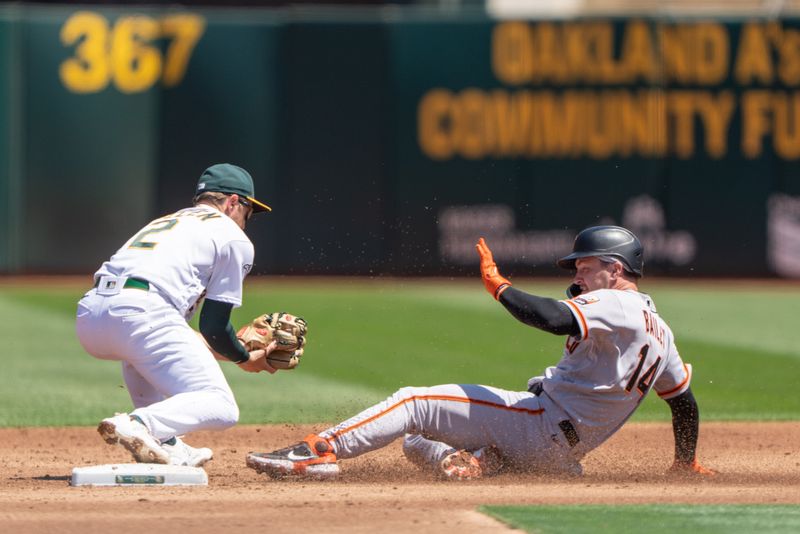 Aug 6, 2023; Oakland, California, USA;  San Francisco Giants catcher Patrick Bailey (14) slides into Oakland Athletics shortstop Nick Allen (2) during the second inning  at Oakland-Alameda County Coliseum. Mandatory Credit: Stan Szeto-USA TODAY Sports