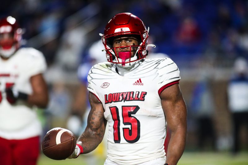 Nov 18, 2021; Durham, North Carolina, USA; Louisville Cardinals running back Jalen Mitchell (15) holds the ball in the end zone during the 1st half of the game against the Louisville Cardinals at Wallace Wade Stadium. Mandatory Credit: Jaylynn Nash-USA TODAY Sports