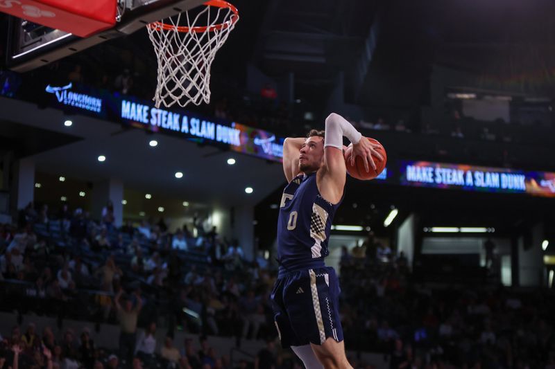 Feb 1, 2025; Atlanta, Georgia, USA; Georgia Tech Yellow Jackets guard Lance Terry (0) dunks against the Louisville Cardinals in the second half at McCamish Pavilion. Mandatory Credit: Brett Davis-Imagn Images