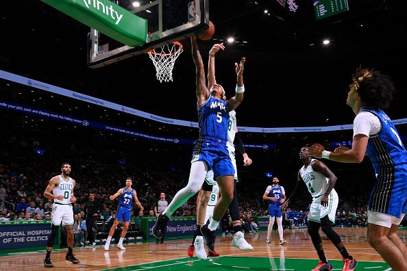 BOSTON, MA - DECEMBER 17: Paolo Banchero #5 of the Orlando Magic shoots the ball during the game against the Boston Celtics on December 17, 2023 at the TD Garden in Boston, Massachusetts. NOTE TO USER: User expressly acknowledges and agrees that, by downloading and or using this photograph, User is consenting to the terms and conditions of the Getty Images License Agreement. Mandatory Copyright Notice: Copyright 2023 NBAE  (Photo by Brian Babineau/NBAE via Getty Images)