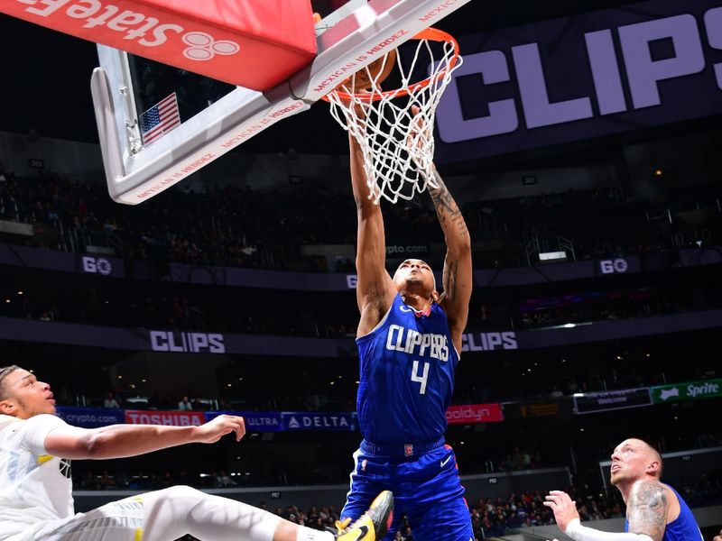 LOS ANGELES, CA - APRIL 12: Brandon Boston Jr. #4 of the LA Clippers dunks the ball during the game against the Utah Jazz on April 12, 2024 at Crypto.Com Arena in Los Angeles, California. NOTE TO USER: User expressly acknowledges and agrees that, by downloading and/or using this Photograph, user is consenting to the terms and conditions of the Getty Images License Agreement. Mandatory Copyright Notice: Copyright 2024 NBAE (Photo by Adam Pantozzi/NBAE via Getty Images)