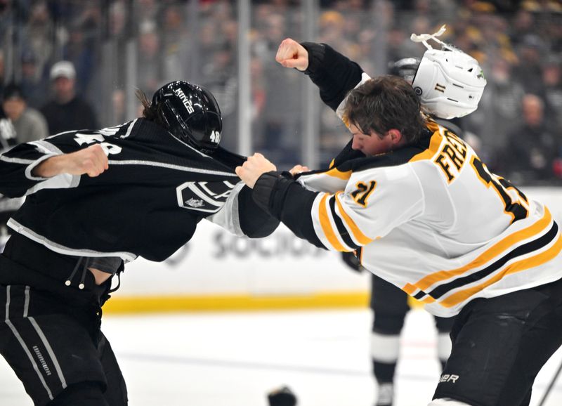 Jan 5, 2023; Los Angeles, California, USA;  Los Angeles Kings left wing Brendan Lemieux (48) and Boston Bruins left wing Taylor Hall (71) fight in the third period at Crypto.com Arena. Mandatory Credit: Jayne Kamin-Oncea-USA TODAY Sports