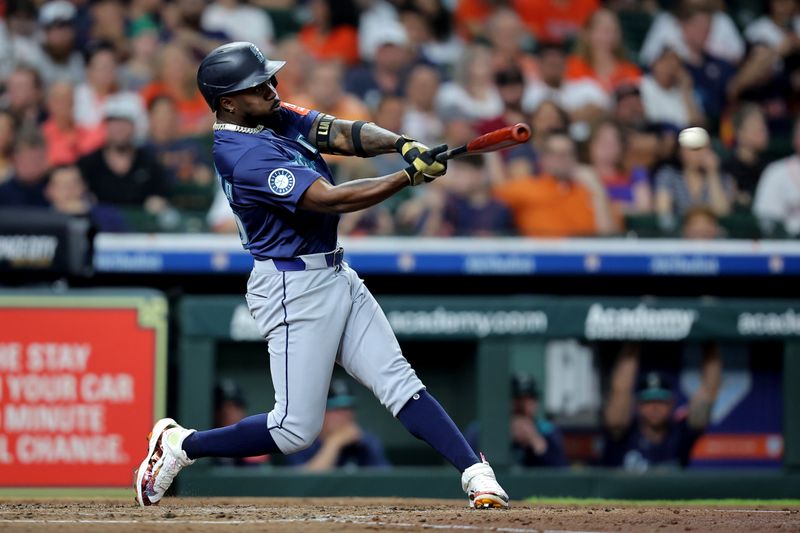 May 23, 2025; Houston, Texas, USA; Seattle Mariners left fielder Randy Arozarena (56) hits a double against the Houston Astros during the fourth inning at Daikin Park. Mandatory Credit: Erik Williams-Imagn Images