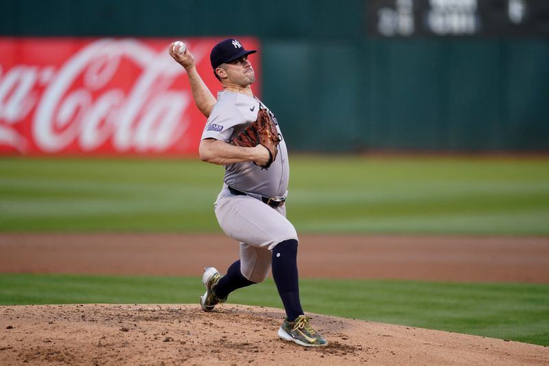 Sep 21, 2024; Oakland, California, USA; New York Yankees pitcher Carlos Rodon (55) delivers a pitch against the Oakland Athletics in the first inning at the Oakland-Alameda County Coliseum. Mandatory Credit: Cary Edmondson-Imagn Images