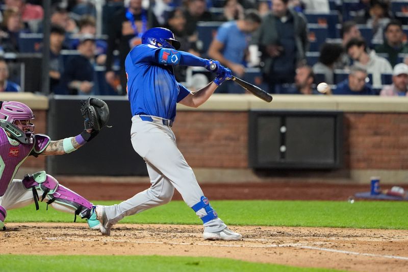 May 10, 2025; New York City, New York, USA; Chicago Cubs first baseman Michael Busch (29) hits a single against the New York Mets during the fifth inning at Citi Field. Mandatory Credit: Gregory Fisher-Imagn Images