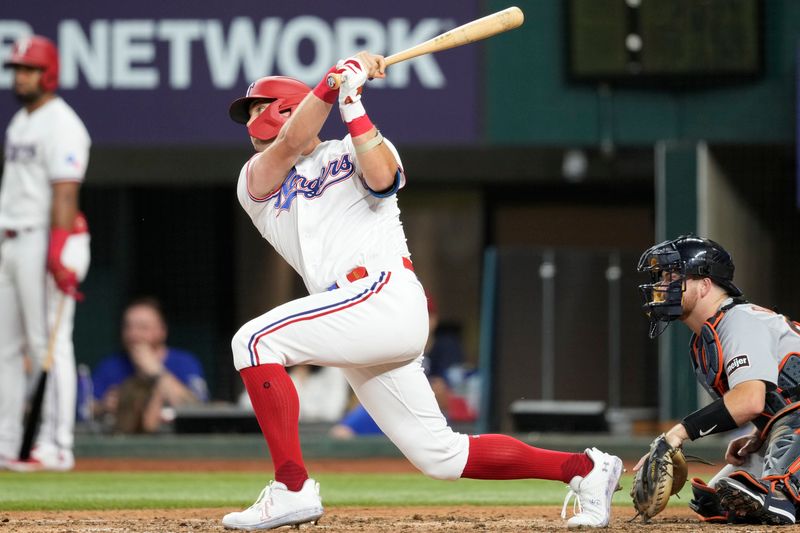 Jun 27, 2023; Arlington, Texas, USA; Texas Rangers third baseman Josh Jung (6) follows through on his RBI single against the Detroit Tigers during the sixth inning at Globe Life Field. Mandatory Credit: Jim Cowsert-USA TODAY Sports