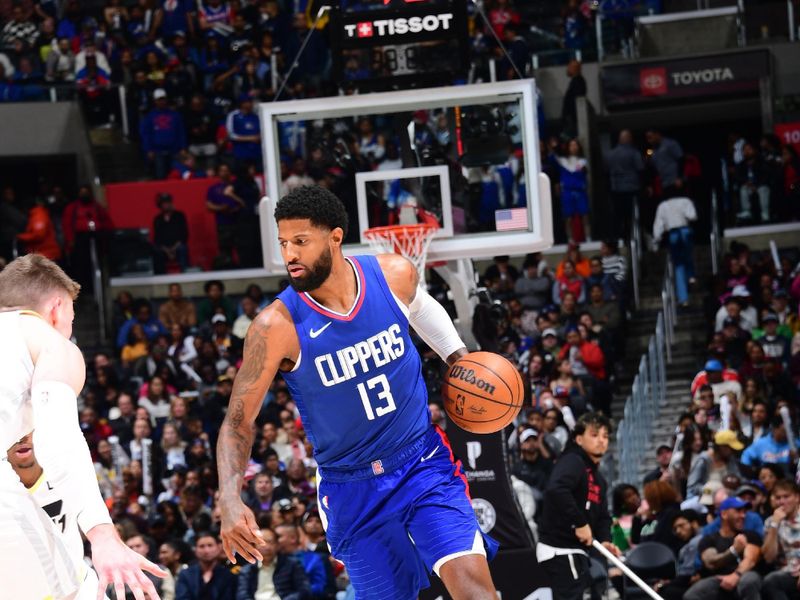 LOS ANGELES, CA - APRIL 5:  Paul George #13 of the LA Clippers handles the ball during the game  on April 5, 2024 at Crypto.Com Arena in Los Angeles, California. NOTE TO USER: User expressly acknowledges and agrees that, by downloading and/or using this Photograph, user is consenting to the terms and conditions of the Getty Images License Agreement. Mandatory Copyright Notice: Copyright 2024 NBAE (Photo by Adam Pantozzi/NBAE via Getty Images)