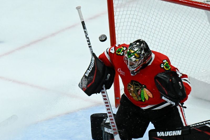 Nov 10, 2024; Chicago, Illinois, USA;  Chicago Blackhawks goaltender Petr Mrazek (34) defends against Minnesota Wild during the third  period at the United Center. Mandatory Credit: Matt Marton-Imagn Images