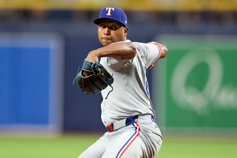 Apr 3, 2024; St. Petersburg, Florida, USA;  Texas Rangers relief pitcher Jose Leclerc (25) throws a pitch against the Tampa Bay Rays in the ninth inning at Tropicana Field. Mandatory Credit: Nathan Ray Seebeck-USA TODAY Sports