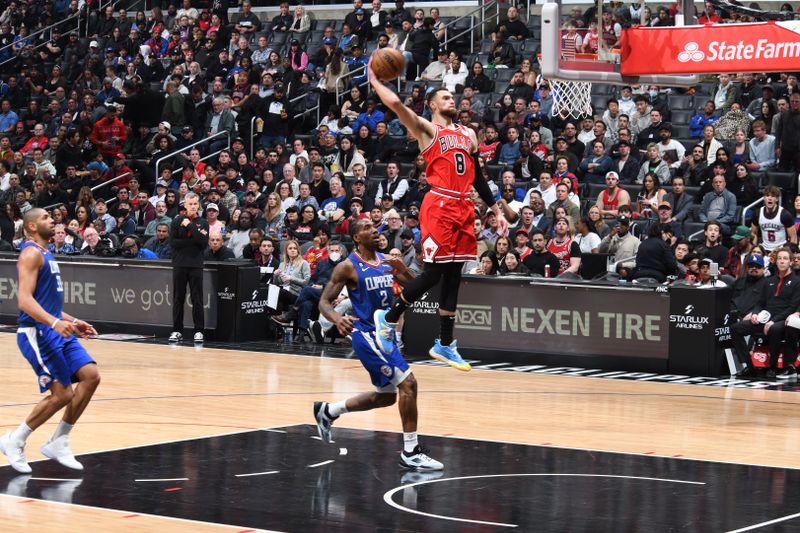 LOS ANGELES, CA - MARCH 27: Zach LaVine #8 of the Chicago Bulls drives to the basket during the game against the LA Clippers on March 27, 2023 at Crypto.Com Arena in Los Angeles, California. NOTE TO USER: User expressly acknowledges and agrees that, by downloading and/or using this Photograph, user is consenting to the terms and conditions of the Getty Images License Agreement. Mandatory Copyright Notice: Copyright 2023 NBAE (Photo by Adam Pantozzi/NBAE via Getty Images)