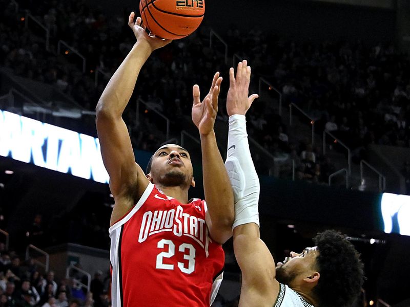 Feb 25, 2024; East Lansing, Michigan, USA;  Ohio State Buckeyes forward Zed Key (23) shoots over Michigan State Spartans forward Malik Hall (25) during the first half at Jack Breslin Student Events Center. Mandatory Credit: Dale Young-USA TODAY Sports