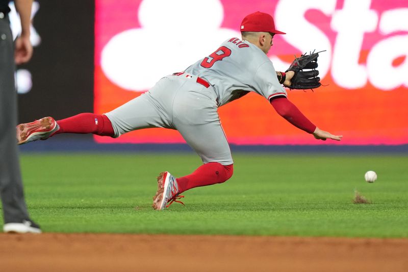 Apr 2, 2024; Miami, Florida, USA; A single by Miami Marlins second baseman Luis Arraez (3) drops in over the head of Los Angeles Angels shortstop Zach Neto (9) in the sixth inning at loanDepot Park. Mandatory Credit: Jim Rassol-USA TODAY Sports