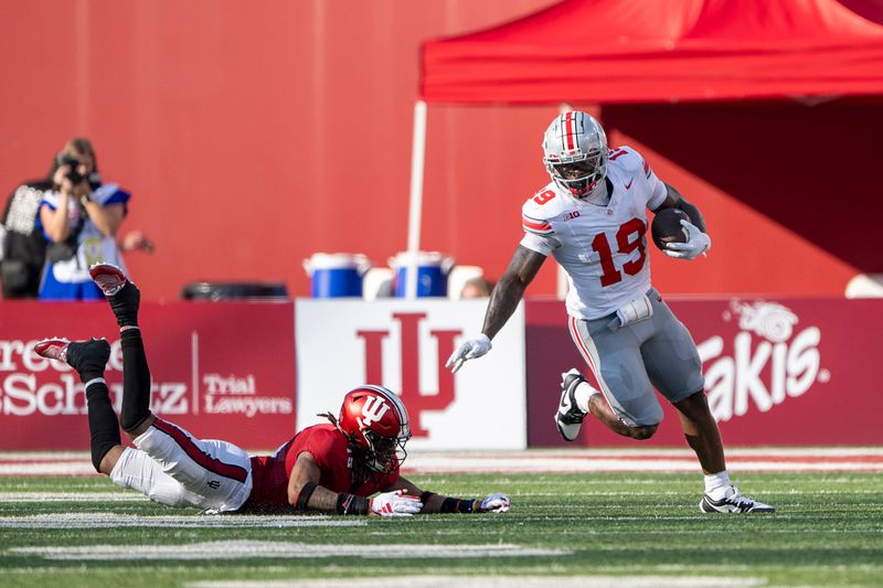 Sep 2, 2023; Bloomington, Indiana, USA; Ohio State Buckeyes running back Chip Trayanum (19) runs the ball during the second half against the Indiana Hoosiers at Memorial Stadium. Mandatory Credit: Marc Lebryk-USA TODAY Sports