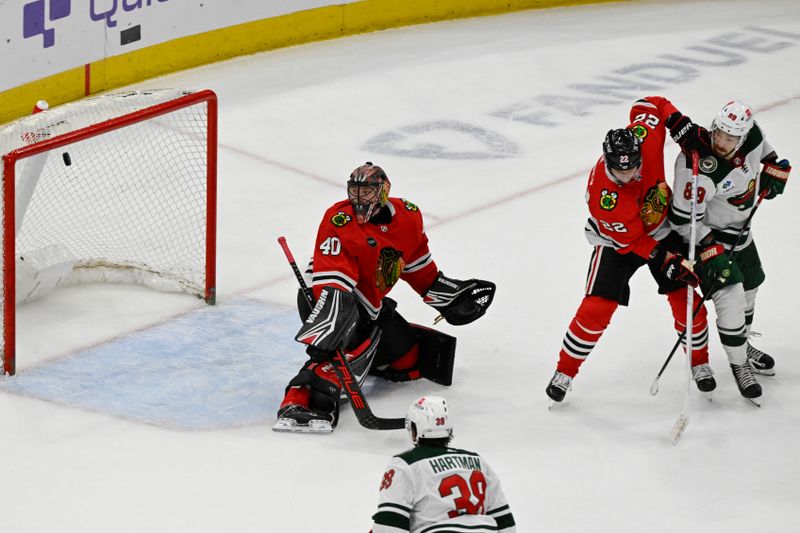 Apr 7, 2024; Chicago, Illinois, USA;  Minnesota Wild center Frederick Gaudreau (89) scores a goal past Chicago Blackhawks goaltender Arvid Soderblom (40) and defenseman Nikita Zaitsev (22) during the second period at United Center. Mandatory Credit: Matt Marton-USA TODAY Sports