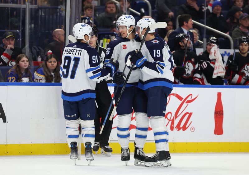 Mar 3, 2024; Buffalo, New York, USA;  Winnipeg Jets center Morgan Barron (36) celebrates his goal with teammates during the third period against the Buffalo Sabres at KeyBank Center. Mandatory Credit: Timothy T. Ludwig-USA TODAY Sports