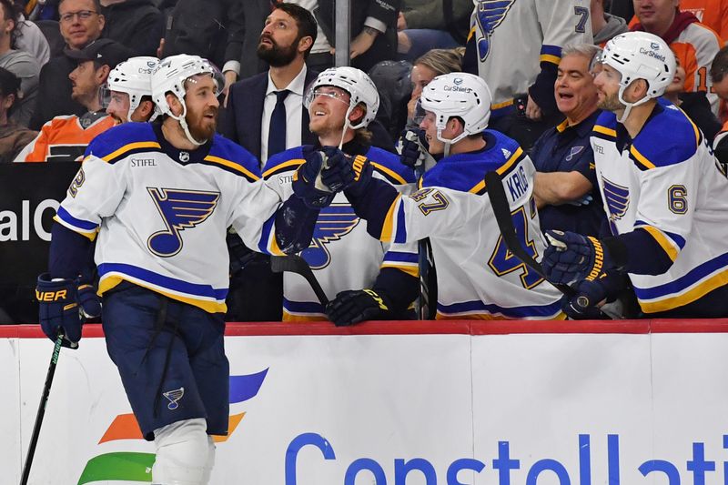 Mar 4, 2024; Philadelphia, Pennsylvania, USA; St. Louis Blues right wing Kevin Hayes (12) celebrates his goal with defenseman Torey Krug (47) and defenseman Marco Scandella (6) against the Philadelphia Flyers during the second period at Wells Fargo Center. Mandatory Credit: Eric Hartline-USA TODAY Sports