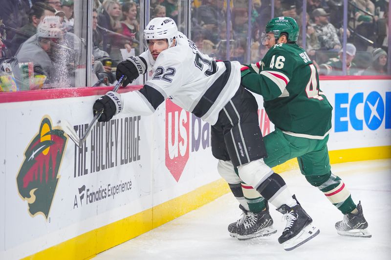 Nov 5, 2024; Saint Paul, Minnesota, USA; Minnesota Wild defenseman Jared Spurgeon (46) checks Los Angeles Kings left wing Kevin Fiala (22) in the first period at Xcel Energy Center. Mandatory Credit: Brad Rempel-Imagn Images