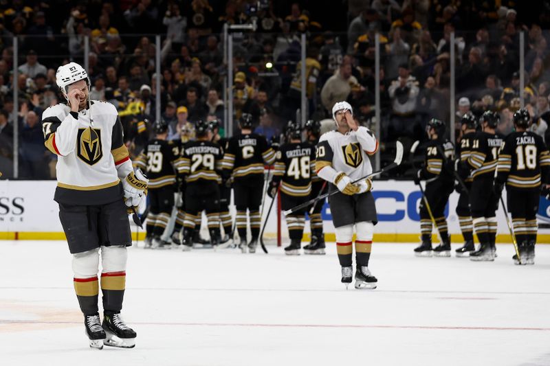 Feb 29, 2024; Boston, Massachusetts, USA; Vegas Golden Knights defenseman Shea Theodore (27) and center Chandler Stephenson (20) head for the locker room as the Boston Bruins congratulate each other after their 5-4 win during the third period at TD Garden. Mandatory Credit: Winslow Townson-USA TODAY Sports