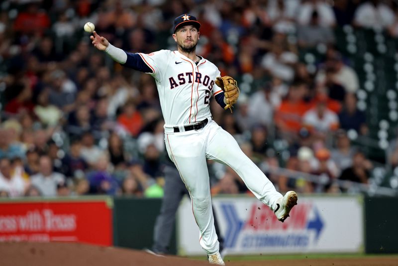 Jul 31, 2024; Houston, Texas, USA; Houston Astros third baseman Alex Bregman (2) throws to first base for an out against the Pittsburgh Pirates during the sixth inning at Minute Maid Park. Mandatory Credit: Erik Williams-USA TODAY Sports